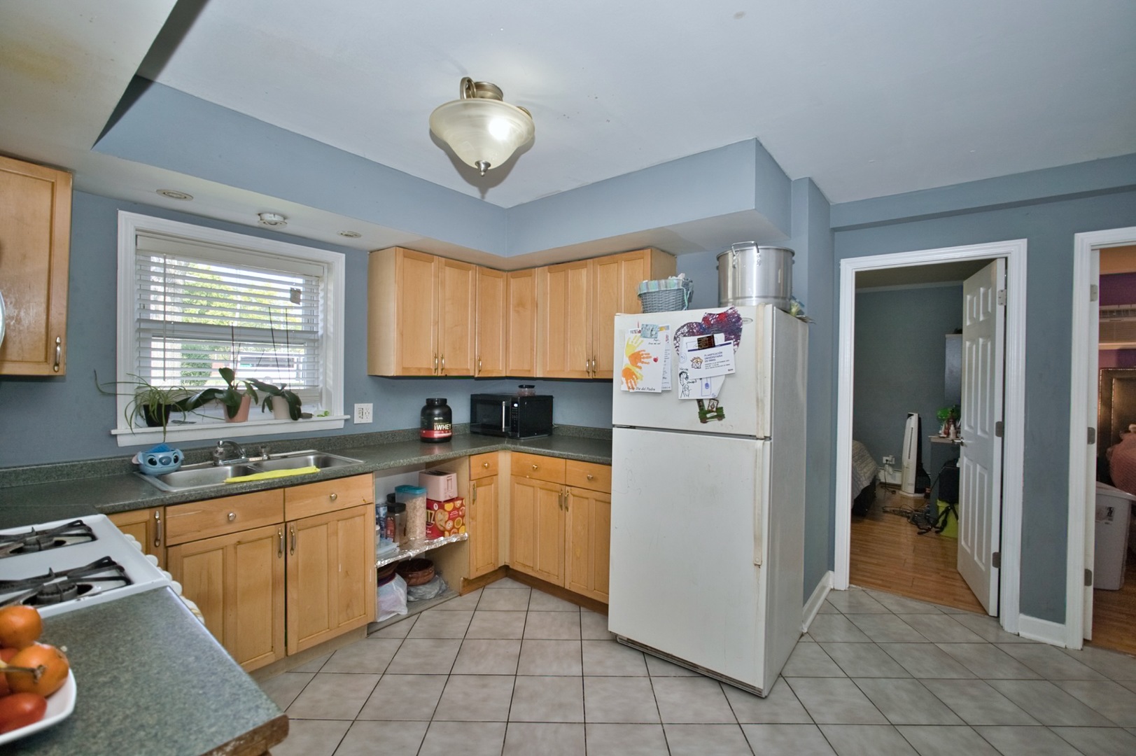 1111 East Algonquin Road, Unit 1 Arlington Heights, IL 60005 - Photo 29 of 42 a kitchen with a white stove top oven and refrigerator