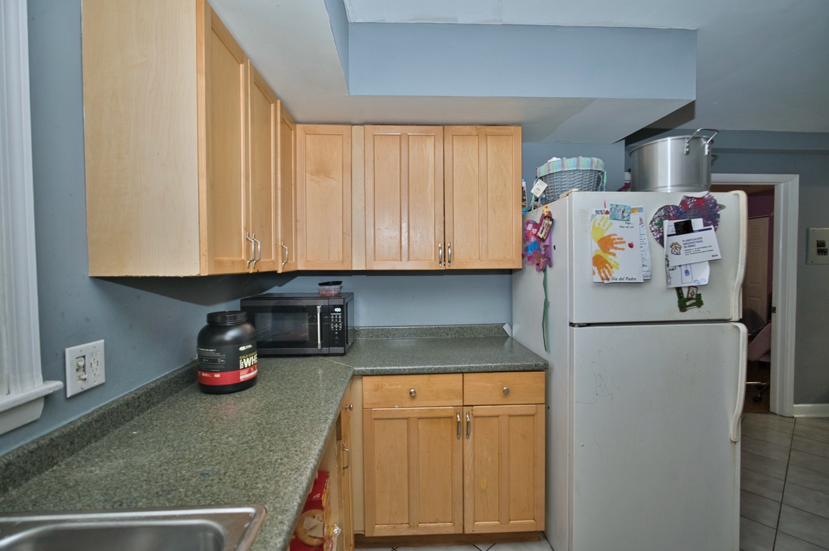 1111 East Algonquin Road, Unit 1 Arlington Heights, IL 60005 - Photo 30 of 42 a kitchen with refrigerator and cabinets