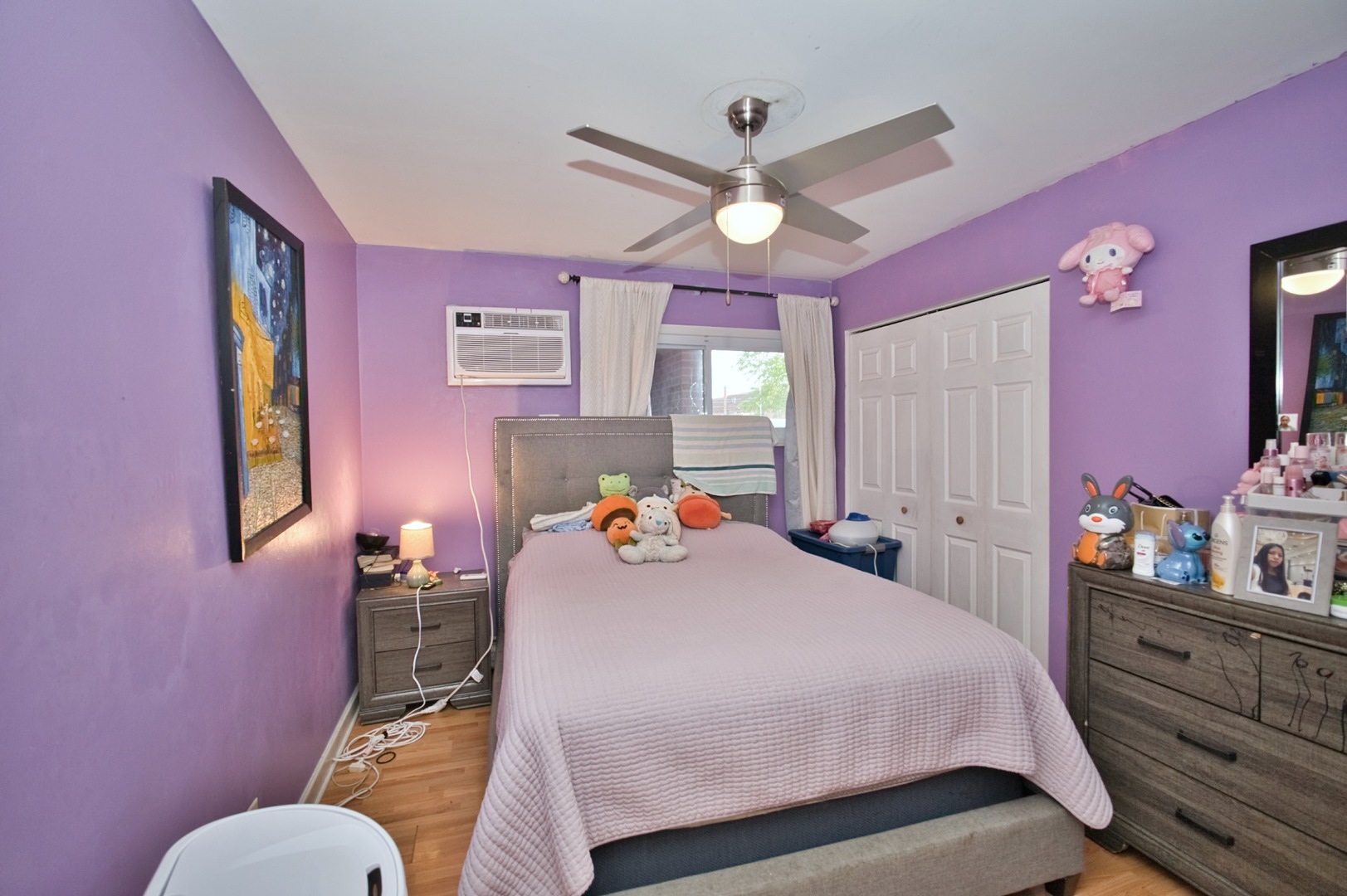 1111 East Algonquin Road, Unit 1 Arlington Heights, IL 60005 - Photo 36 of 42 a bedroom with a bed and a chandelier