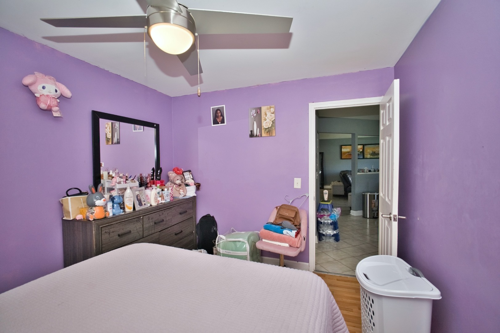 1111 East Algonquin Road, Unit 1 Arlington Heights, IL 60005 - Photo 37 of 42 a bedroom with a bed and a dresser