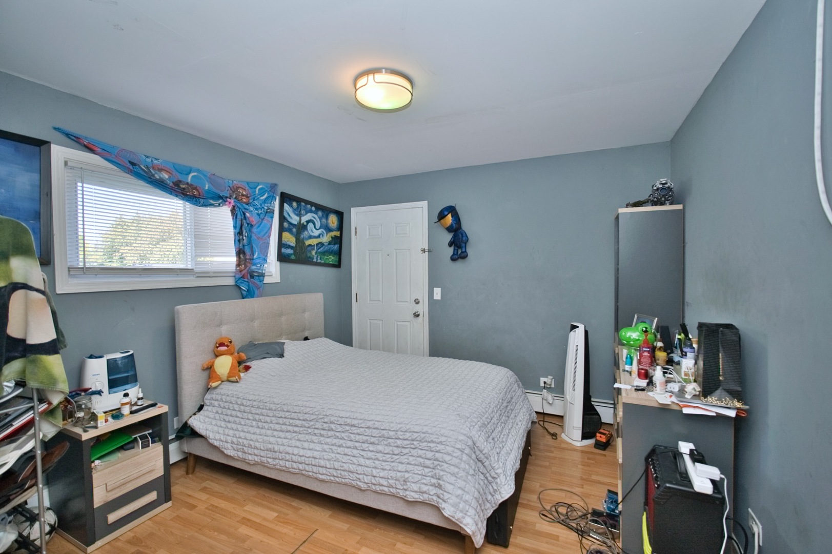 1111 East Algonquin Road, Unit 1 Arlington Heights, IL 60005 - Photo 39 of 42 a bedroom with a bed and wooden floor