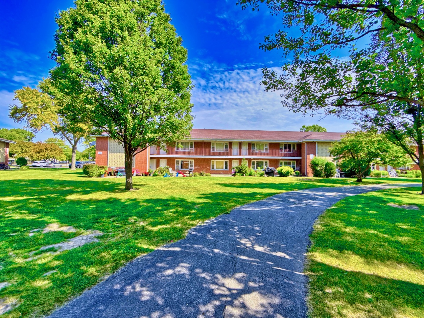 1111 East Algonquin Road, Unit 1 Arlington Heights, IL 60005 - Photo 5 of 42 a view of an house with a yard