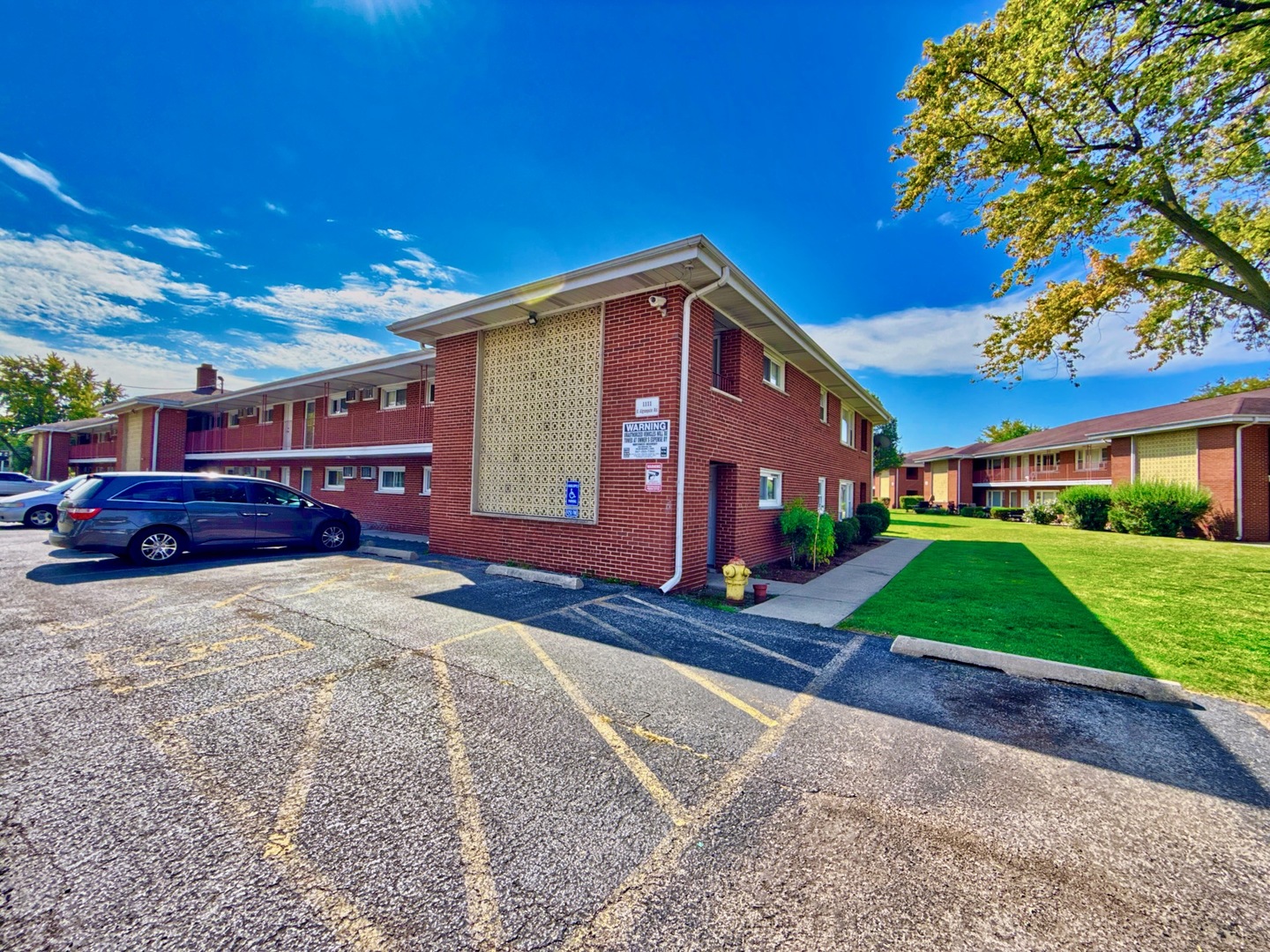 1111 East Algonquin Road, Unit 1 Arlington Heights, IL 60005 - Photo 6 of 42 a view of brick house with a yard