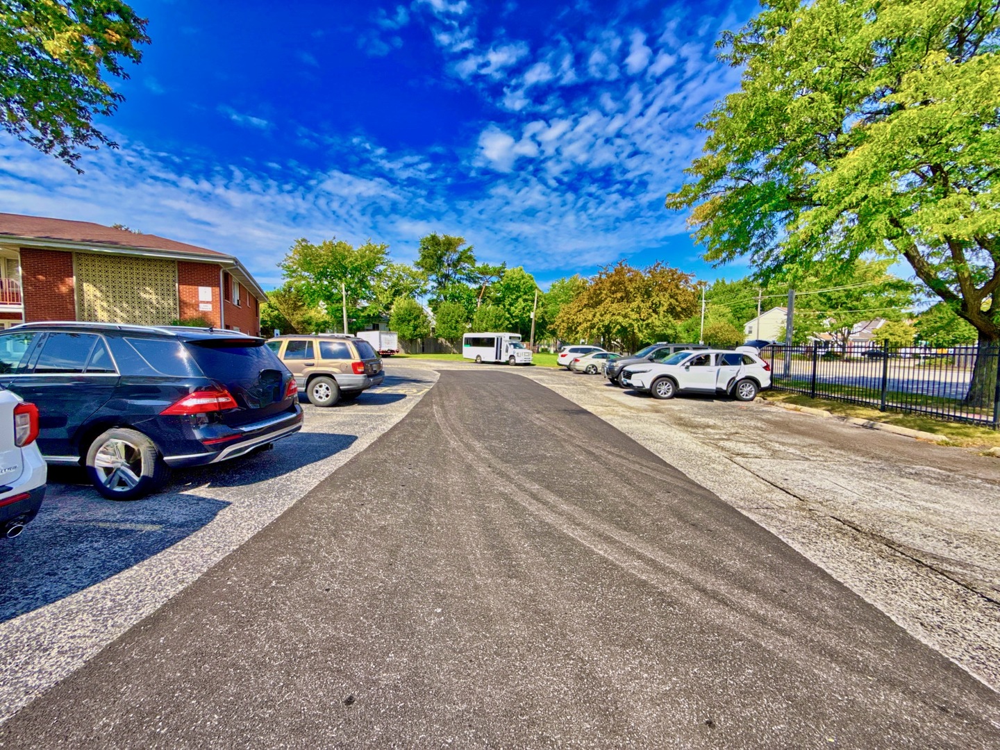 1111 East Algonquin Road, Unit 1 Arlington Heights, IL 60005 - Photo 8 of 42 a view of a cars parked on the side of a street