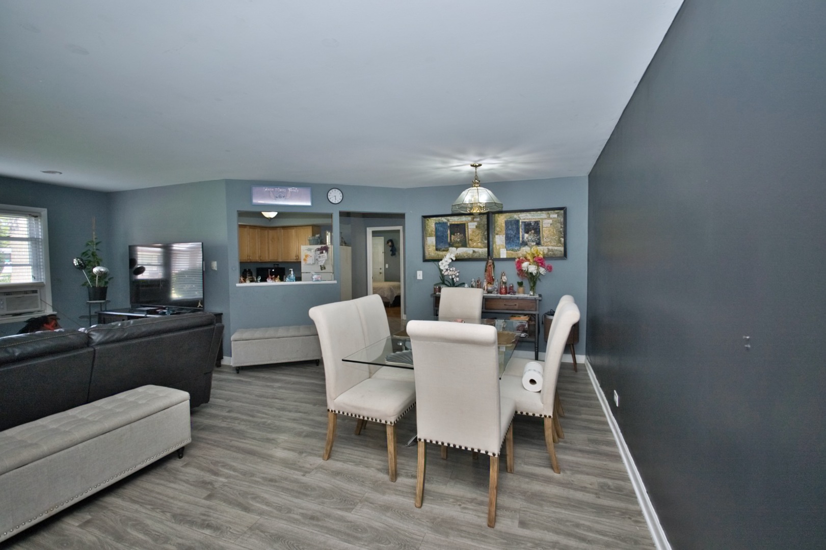 1111 East Algonquin Road, Unit 1 Arlington Heights, IL 60005 - Photo 9 of 42 a view of a dining room with furniture window and wooden floor