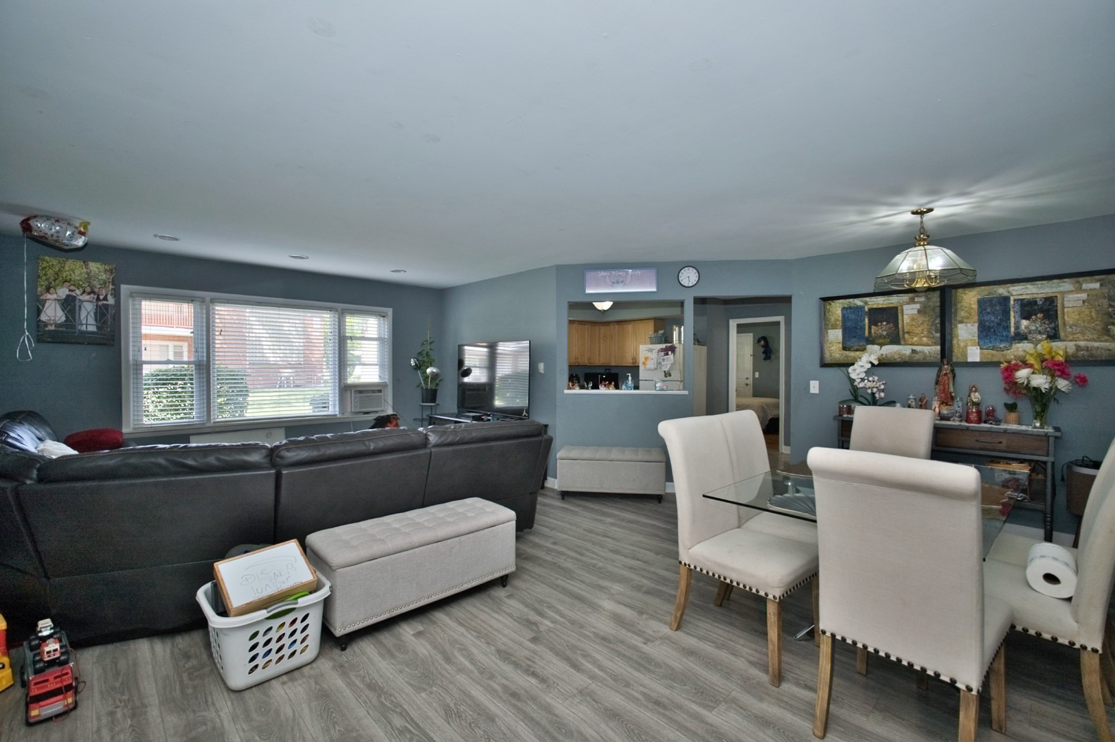 1111 East Algonquin Road, Unit 1 Arlington Heights, IL 60005 - Photo 10 of 42 a living room with furniture and a wooden floor