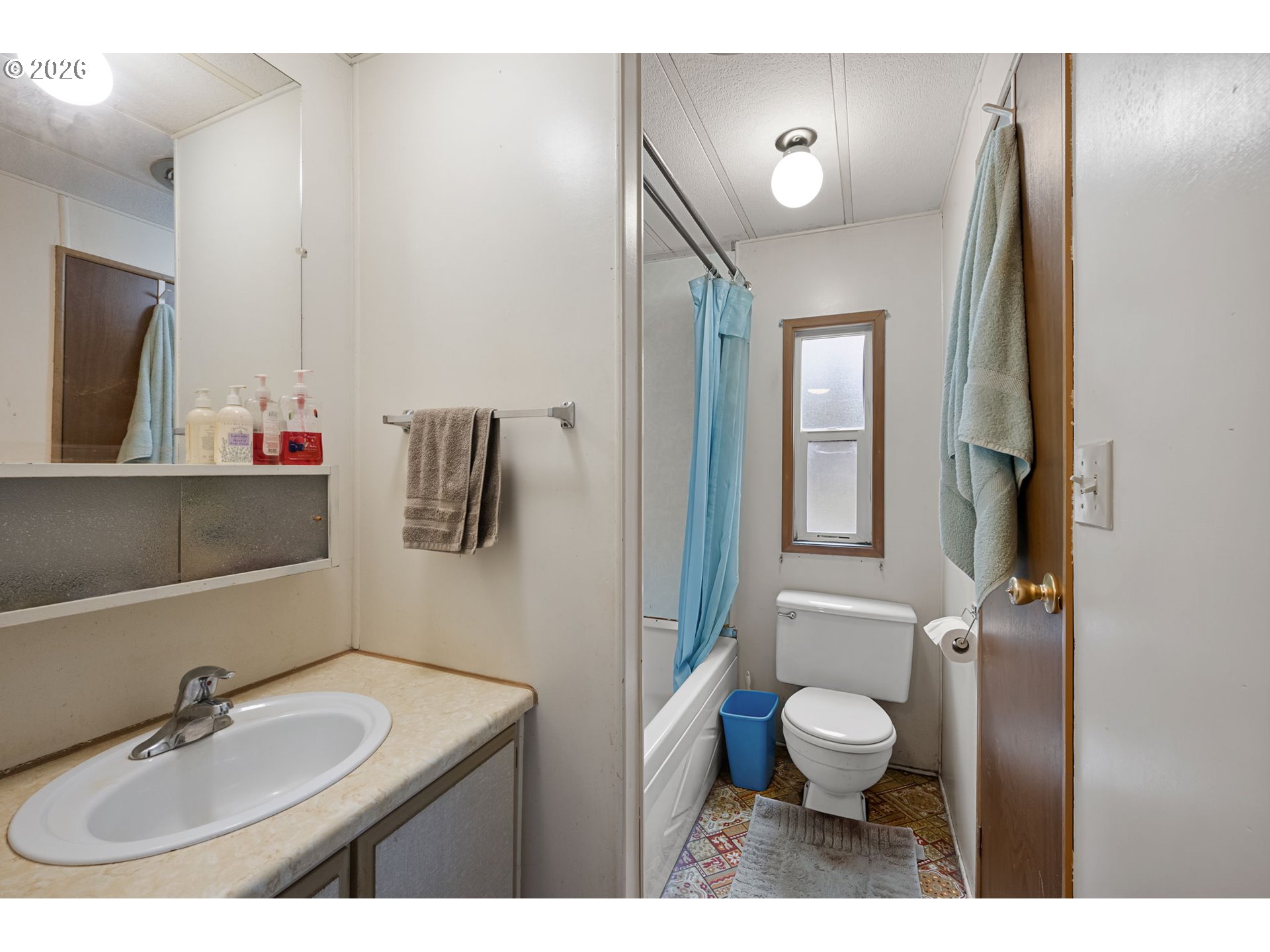 4826 Rhododendron Loop Florence, OR 97439 - Photo 23 of 41 a bathroom with a sink a toilet and mirror