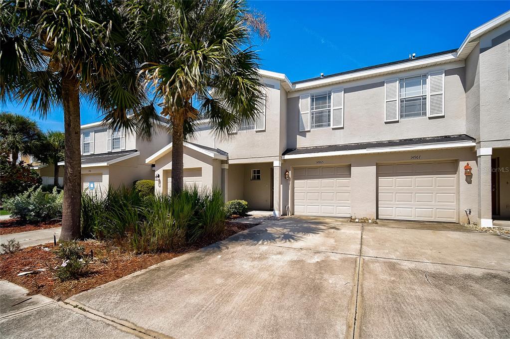 14965 Skip Jack Loop Lakewood Ranch, FL 34202 - Photo 1 of 1 a front view of a house with a yard and garage