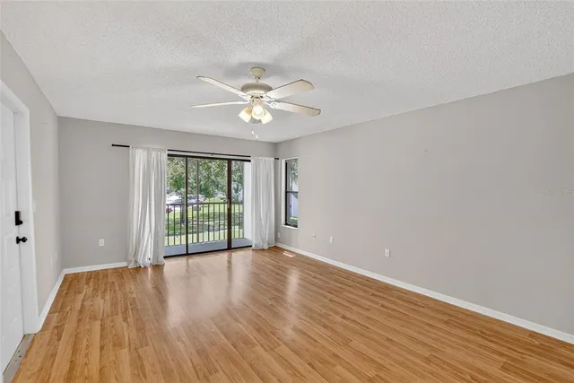 a view of kitchen with furniture and wooden floor
