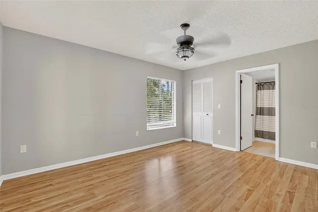 a bathroom with a sink toilet vanity and shower