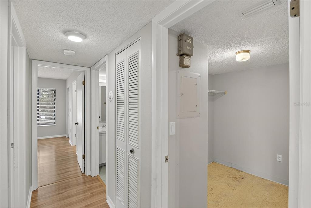 1225 Pine Ridge Circle West, Unit A2 Tarpon Springs, FL 34688 - Photo 35 of 59 a view of a hallway with wooden floor