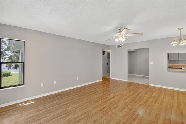 an aerial view of a house garden and swimming pool