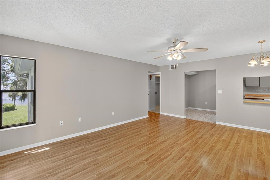 1225 Pine Ridge Circle West, Unit A2 Tarpon Springs, FL 34688 - Photo 46 of 59 a view of an empty room with a window
