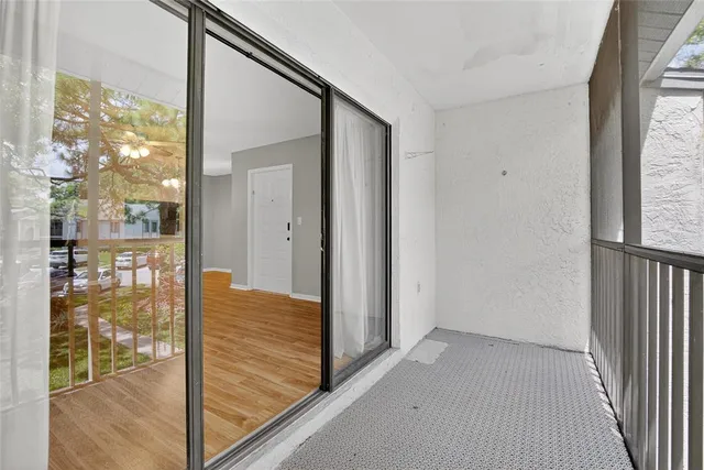 a view of a wooden house with a yard