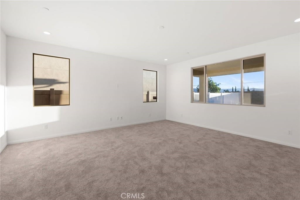 17727 Santa Lucia Court Riverside, CA 92503 - Photo 15 of 42 an empty room with windows and closet