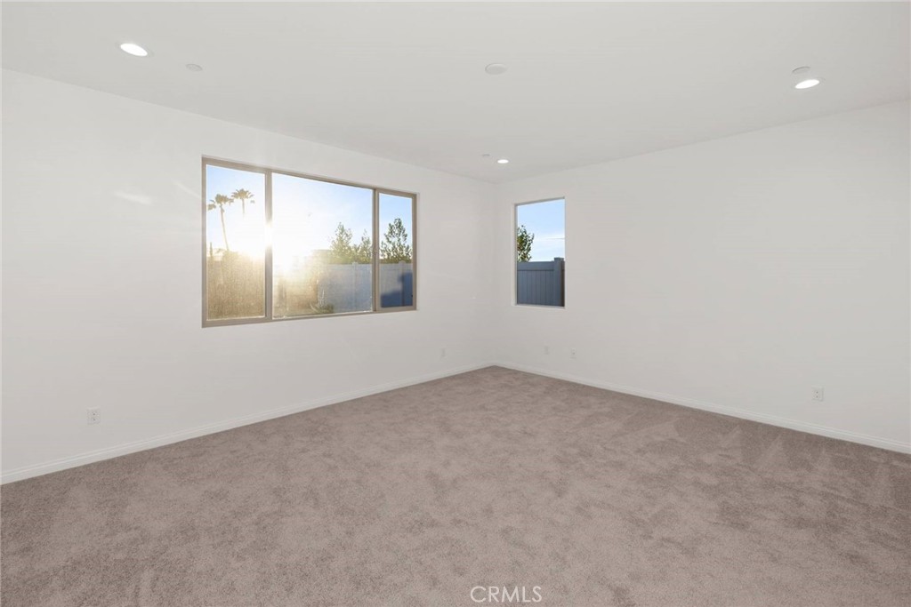17727 Santa Lucia Court Riverside, CA 92503 - Photo 16 of 42 an empty room with windows and cabinet