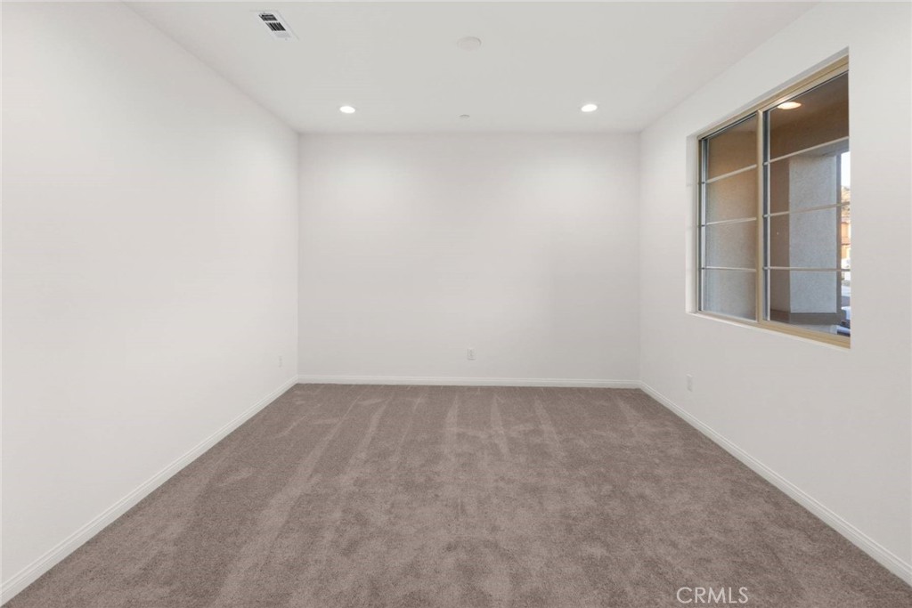 17727 Santa Lucia Court Riverside, CA 92503 - Photo 23 of 42 an empty room with windows
