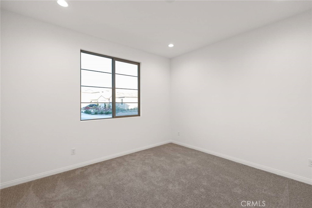 17727 Santa Lucia Court Riverside, CA 92503 - Photo 24 of 42 an empty room with windows