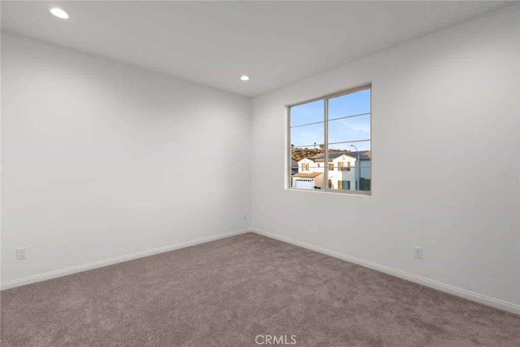 17727 Santa Lucia Court Riverside, CA 92503 - Photo 34 of 42 an empty room with windows