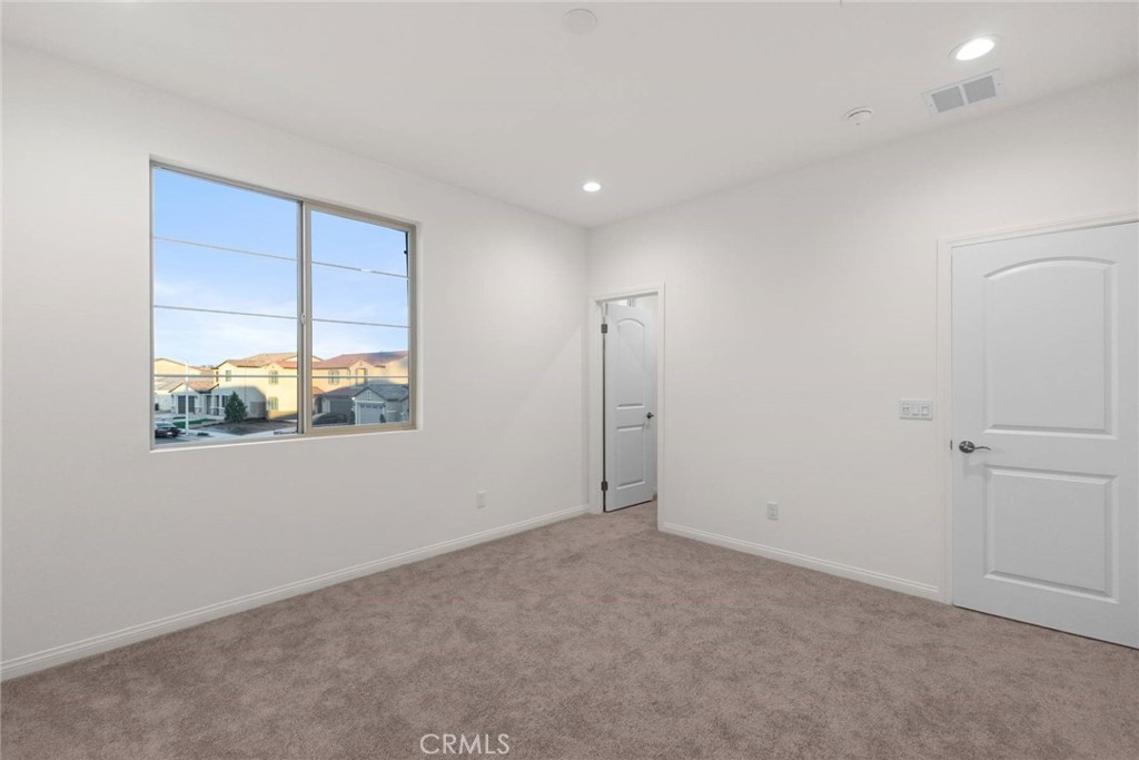 17727 Santa Lucia Court Riverside, CA 92503 - Photo 36 of 42 an empty room with a window