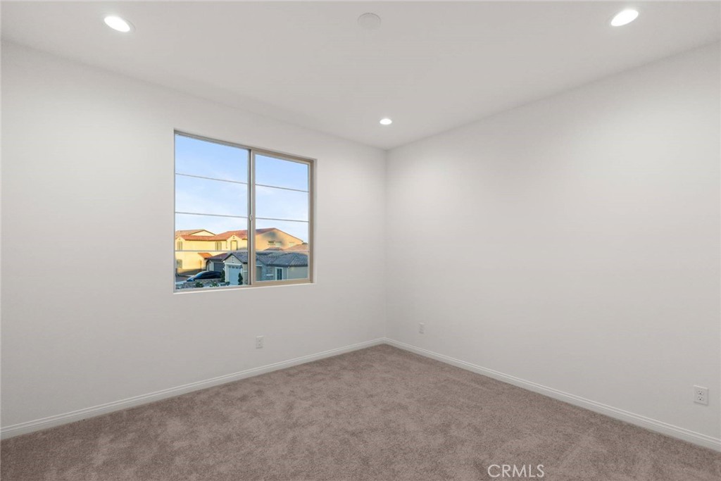 17727 Santa Lucia Court Riverside, CA 92503 - Photo 37 of 42 an empty room with windows