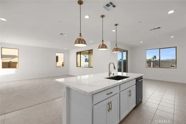 a kitchen with sink and window