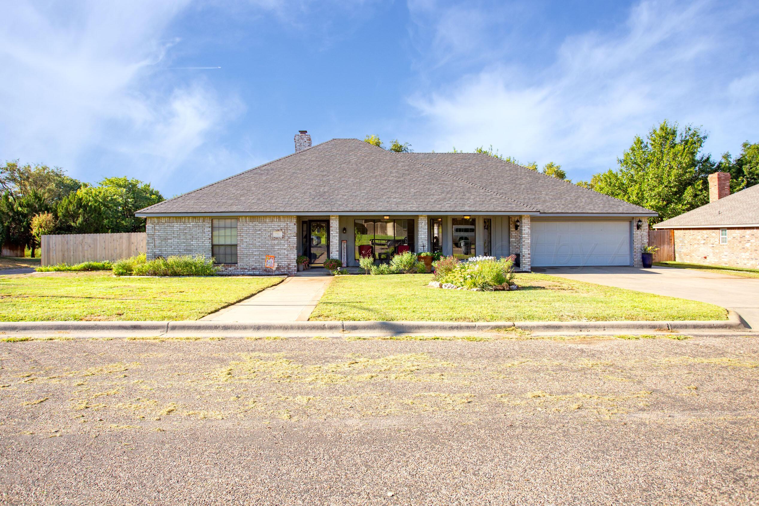 7301 Smoketree Drive Amarillo, TX 79124 - Photo 1 of 37 a view of a house with a swimming pool and a yard