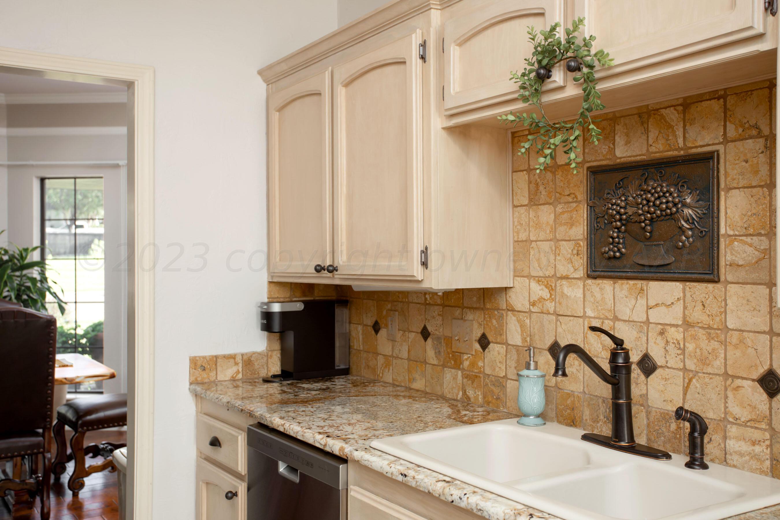 7301 Smoketree Drive Amarillo, TX 79124 - Photo 13 of 37 a kitchen with a sink and cabinets