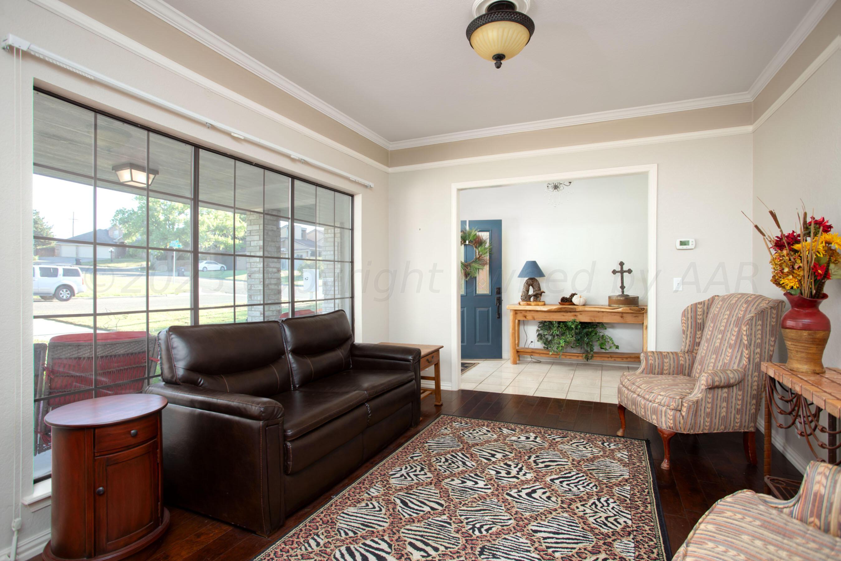 7301 Smoketree Drive Amarillo, TX 79124 - Photo 16 of 37 a living room with furniture and a window