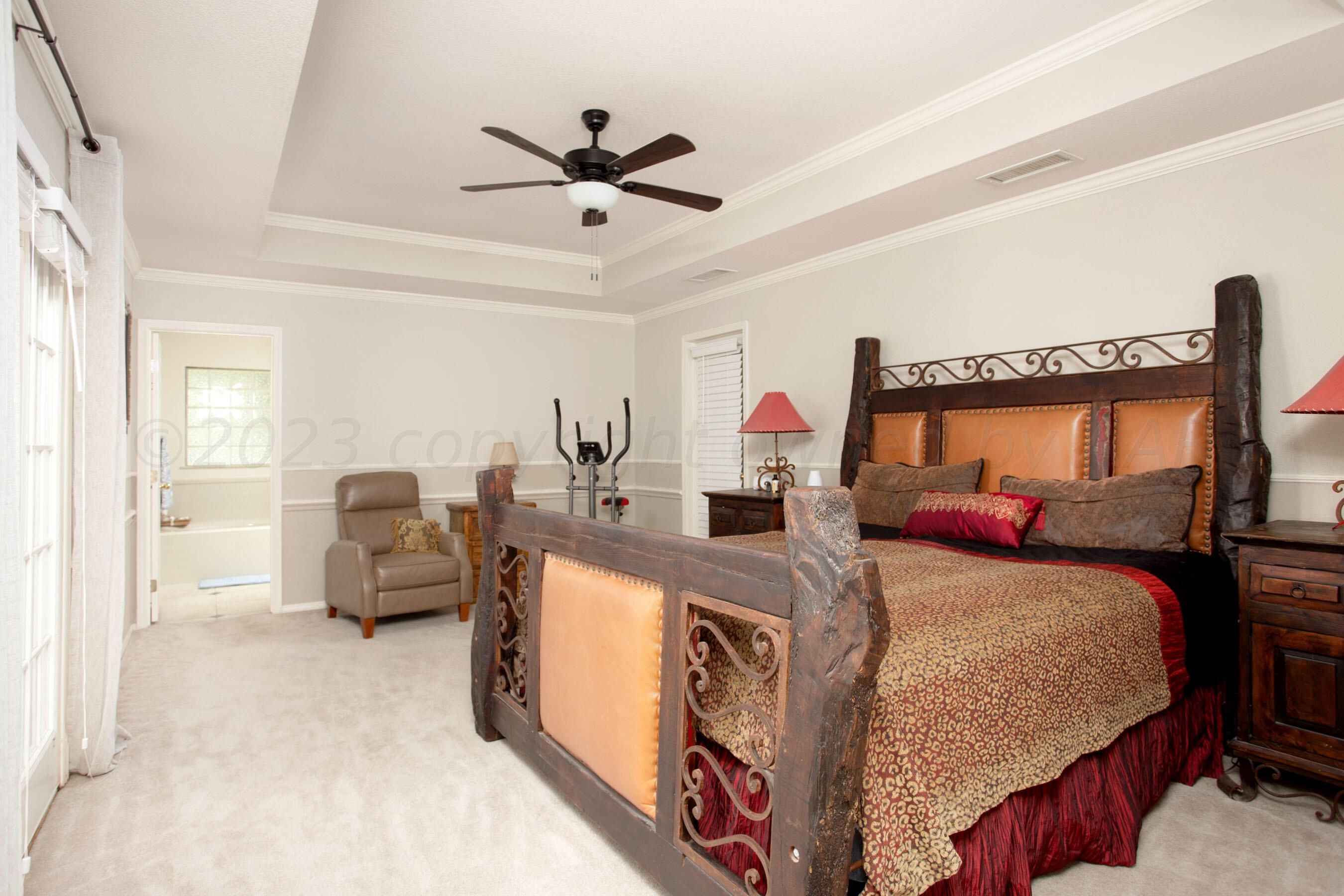 7301 Smoketree Drive Amarillo, TX 79124 - Photo 18 of 37 a bed room with a bed and a couch