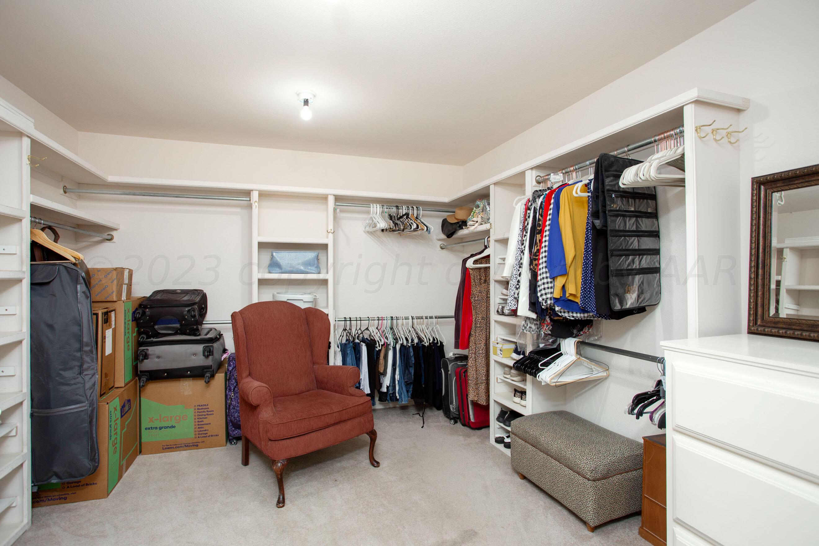 7301 Smoketree Drive Amarillo, TX 79124 - Photo 23 of 37 a view of walk in closet with clothes and shoes