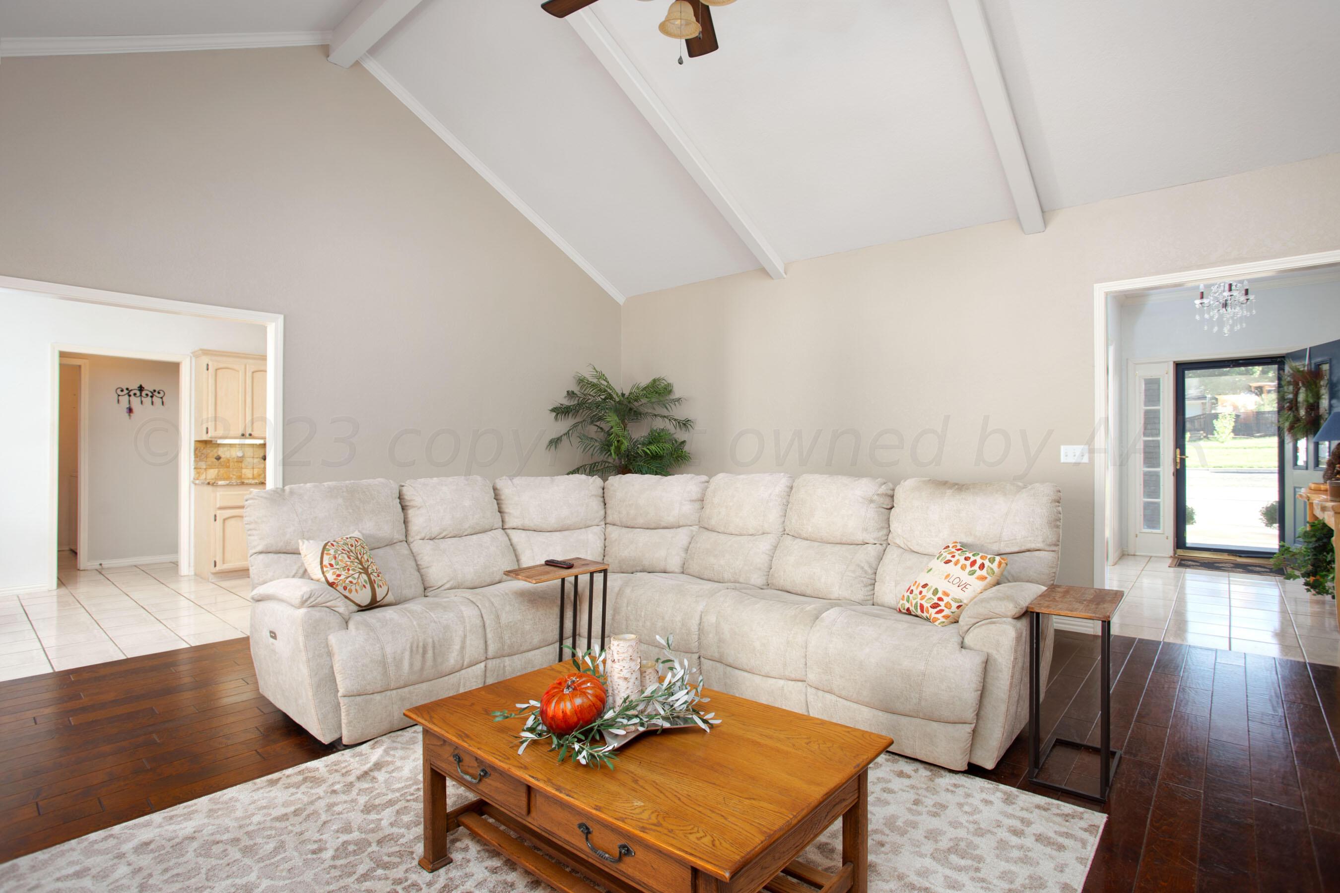 7301 Smoketree Drive Amarillo, TX 79124 - Photo 6 of 37 a living room with furniture and wooden floor