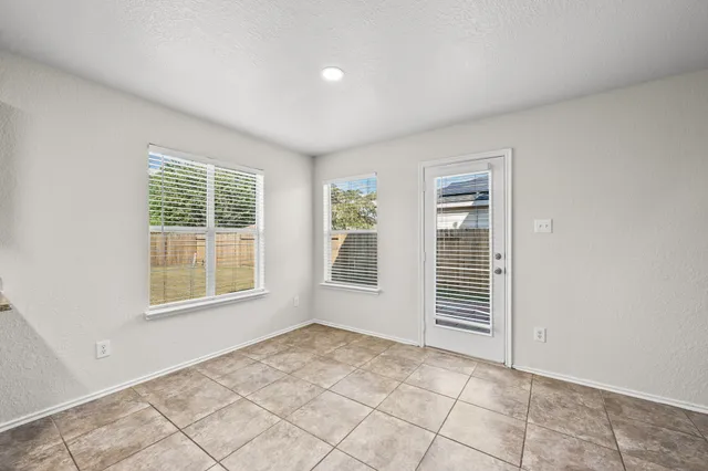 an empty room with windows