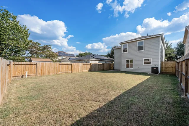 a view of a backyard of the house