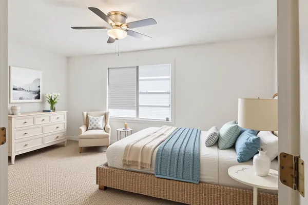 a bedroom with a bed and a dresser