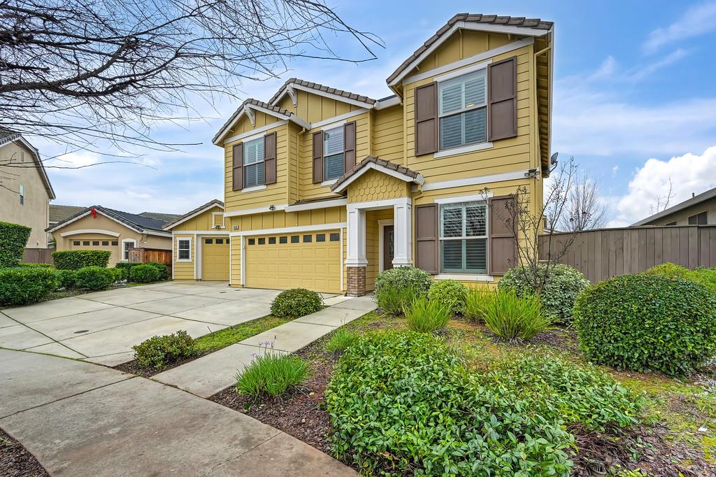 1916 Hartsfield Way Lincoln, CA 95648 - Photo 2 of 35 a front view of a house with a yard and garage