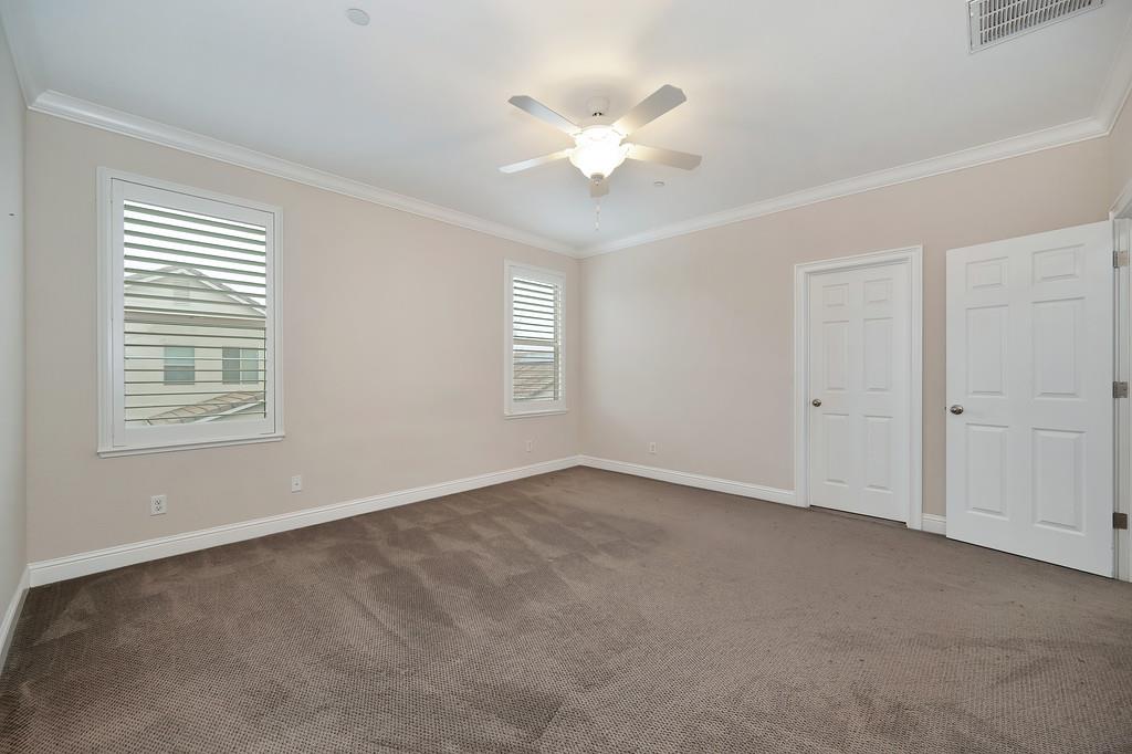 1916 Hartsfield Way Lincoln, CA 95648 - Photo 28 of 35 an empty room with windows and fan