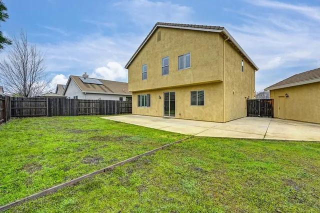 a house view with garden space
