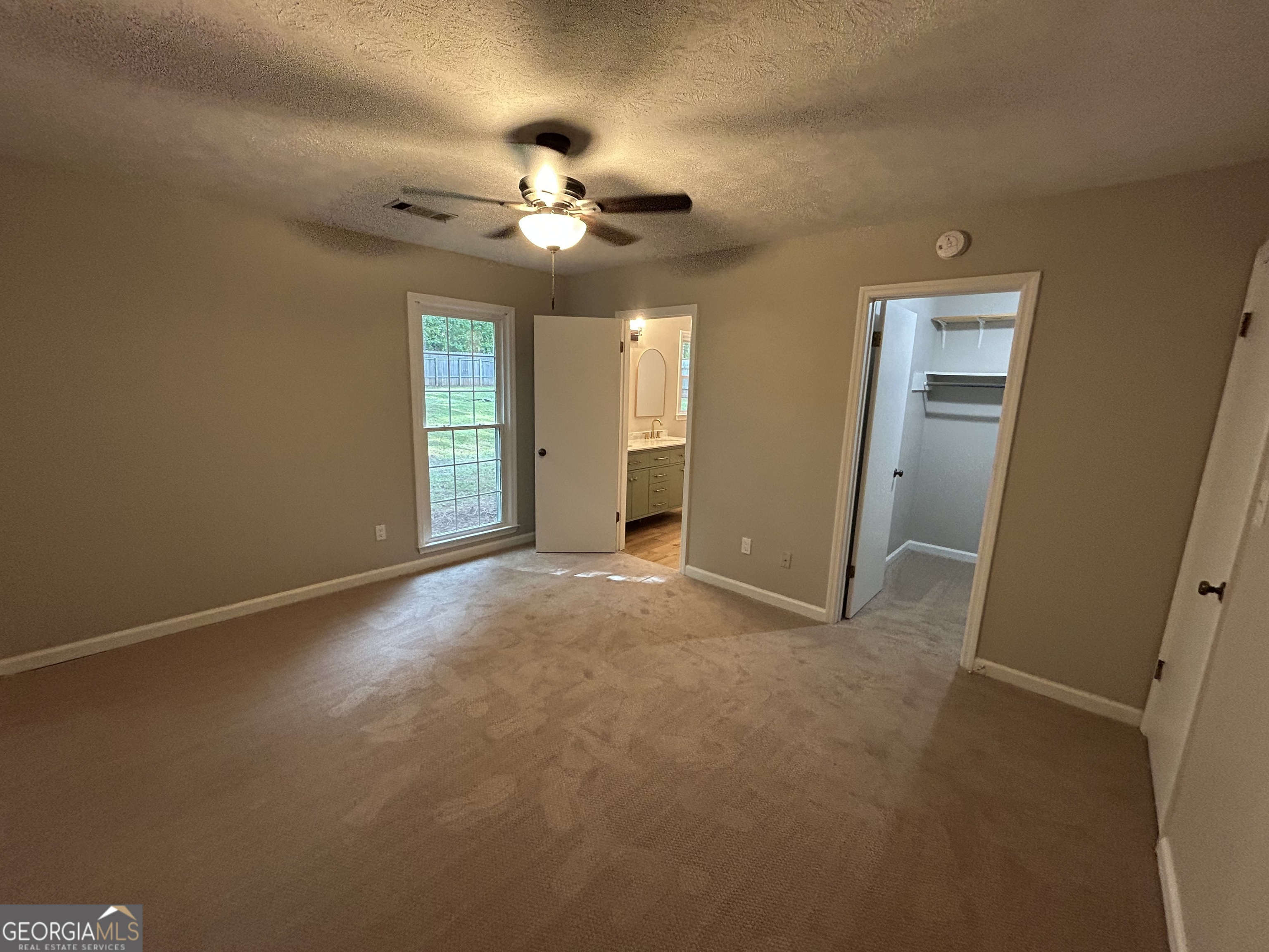 191 Moccasin Trail LaGrange, GA 30241 - Photo 18 of 32 a view of an empty room with a chandelier fan
