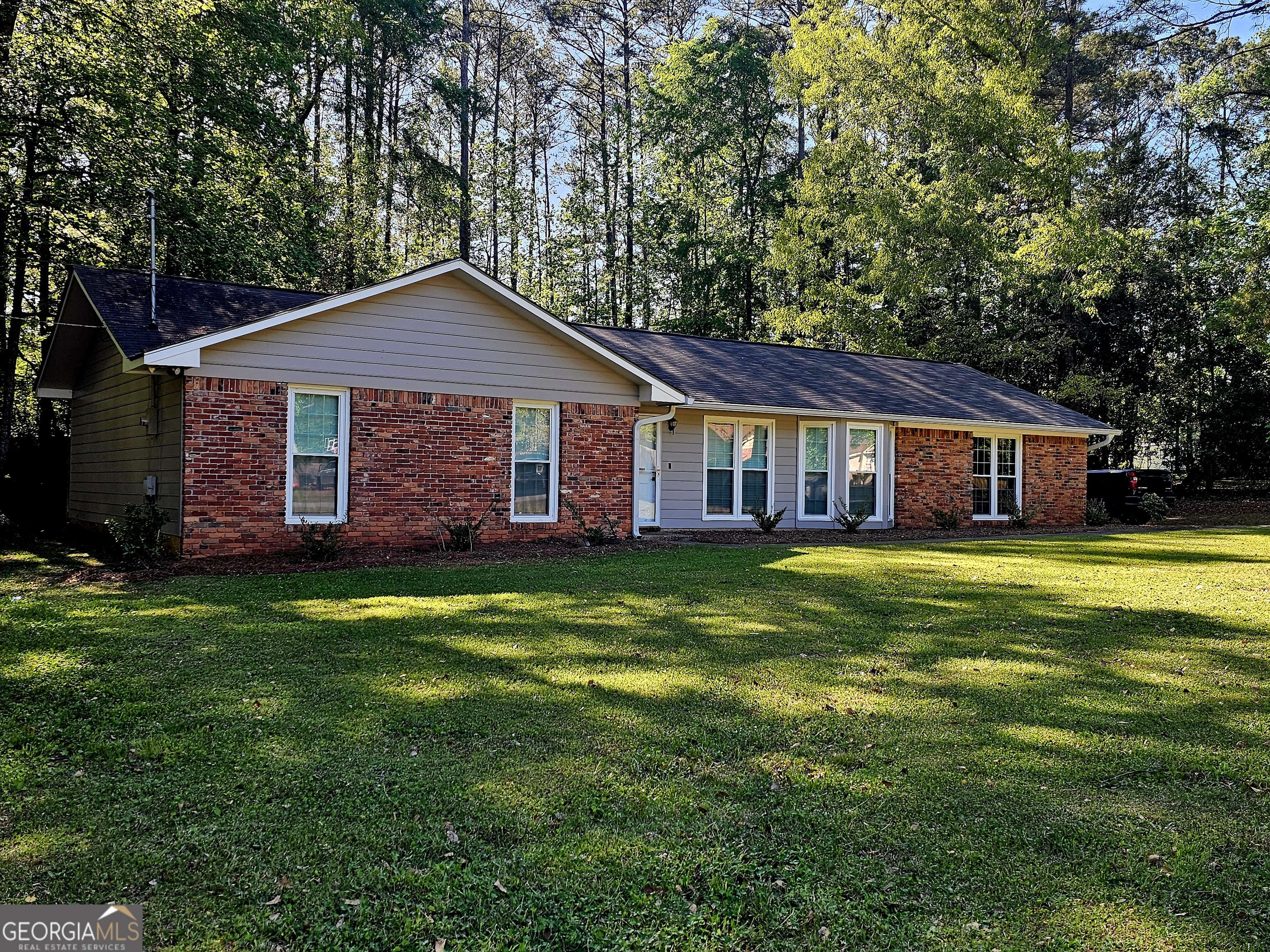 191 Moccasin Trail LaGrange, GA 30241 - Photo 2 of 32 a front view of a house with a garden and porch