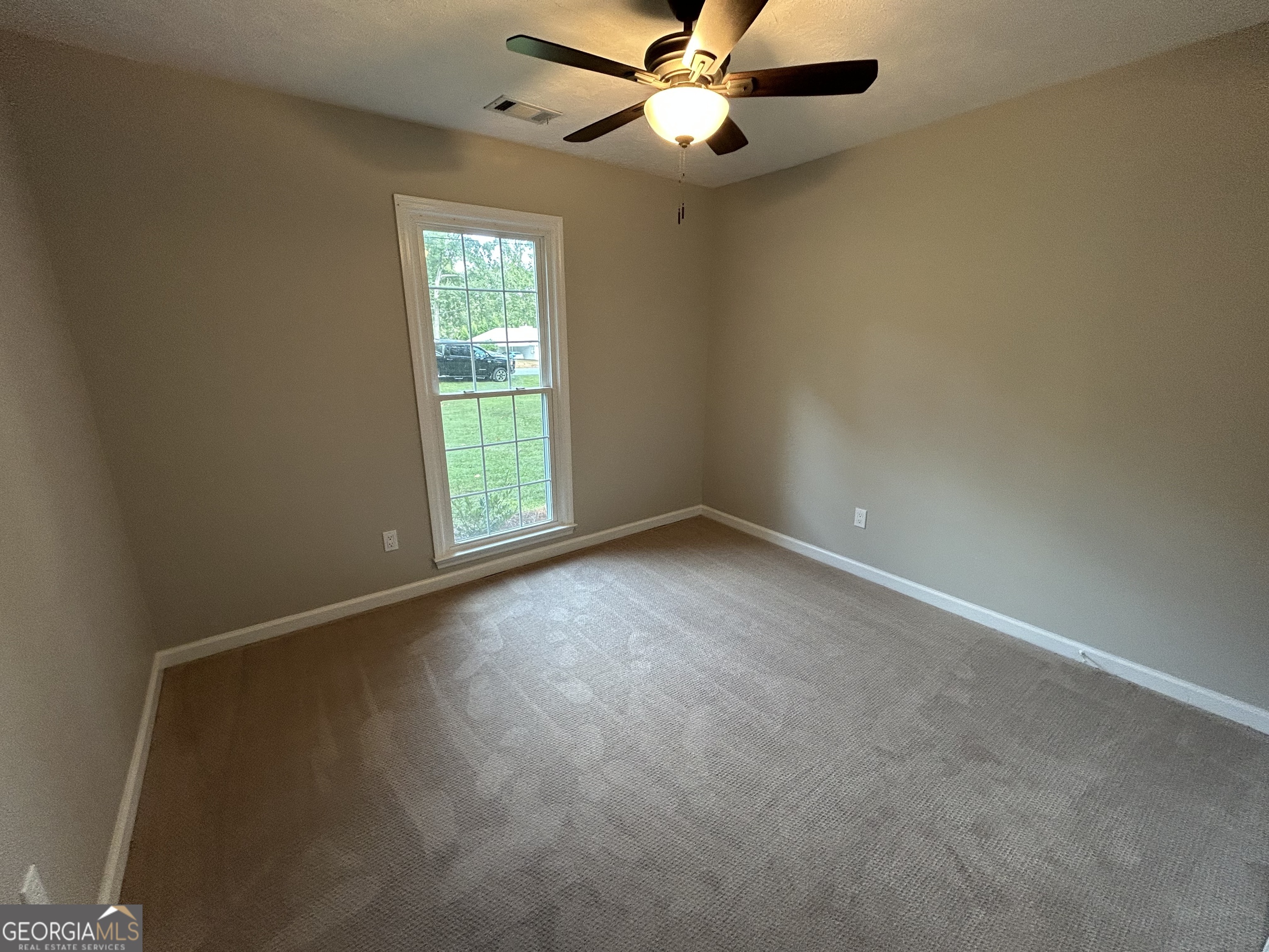 191 Moccasin Trail LaGrange, GA 30241 - Photo 23 of 32 an empty room with windows and fan