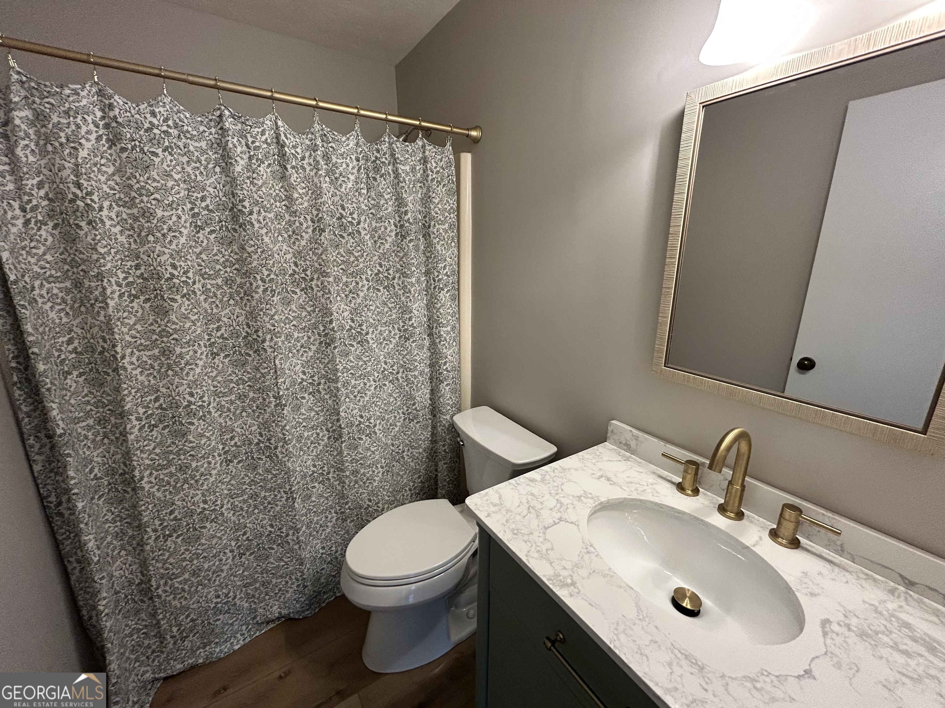191 Moccasin Trail LaGrange, GA 30241 - Photo 24 of 32 a bathroom with a sink and a mirror