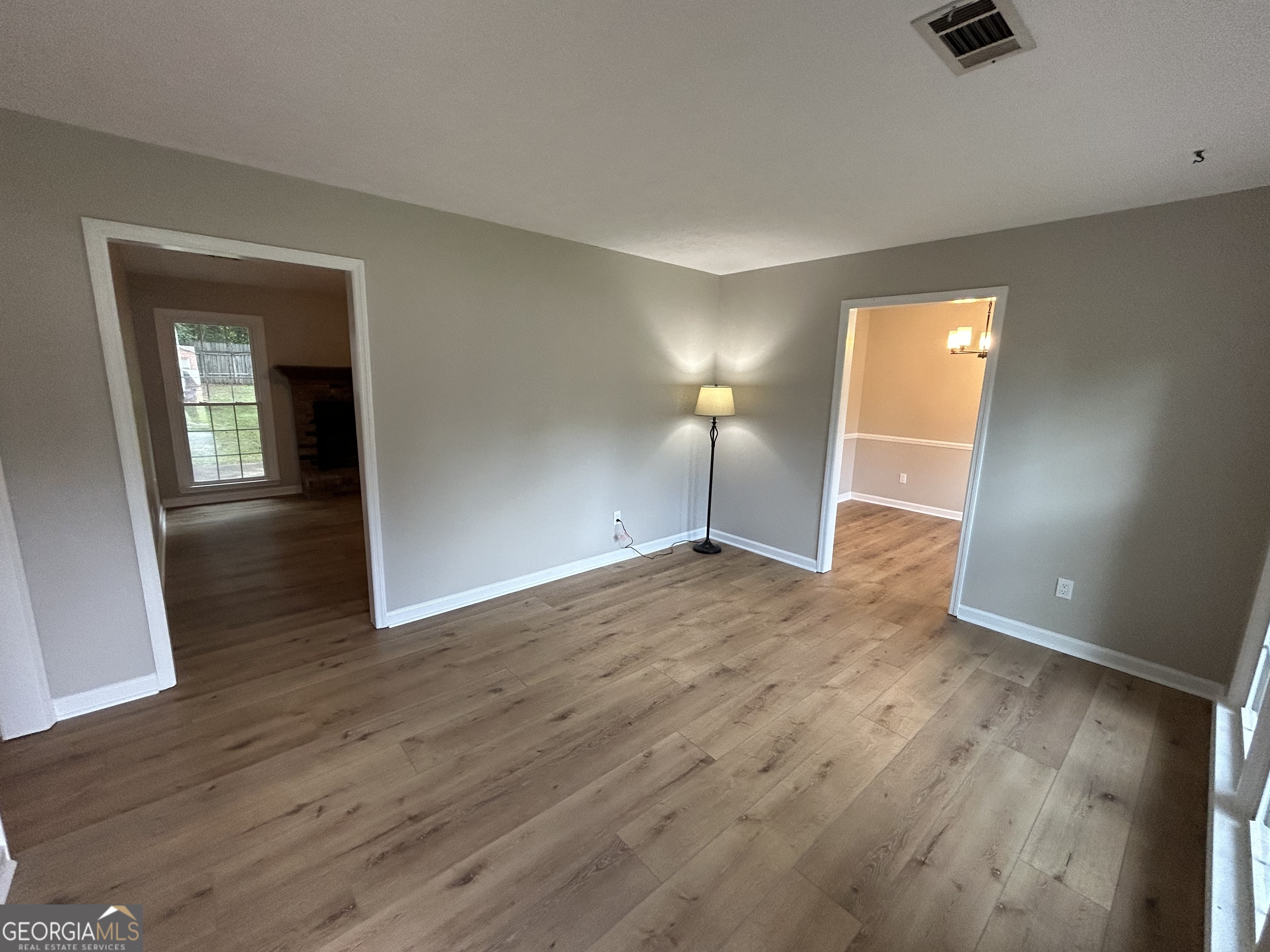 191 Moccasin Trail LaGrange, GA 30241 - Photo 7 of 32 an empty room with wooden floor and windows