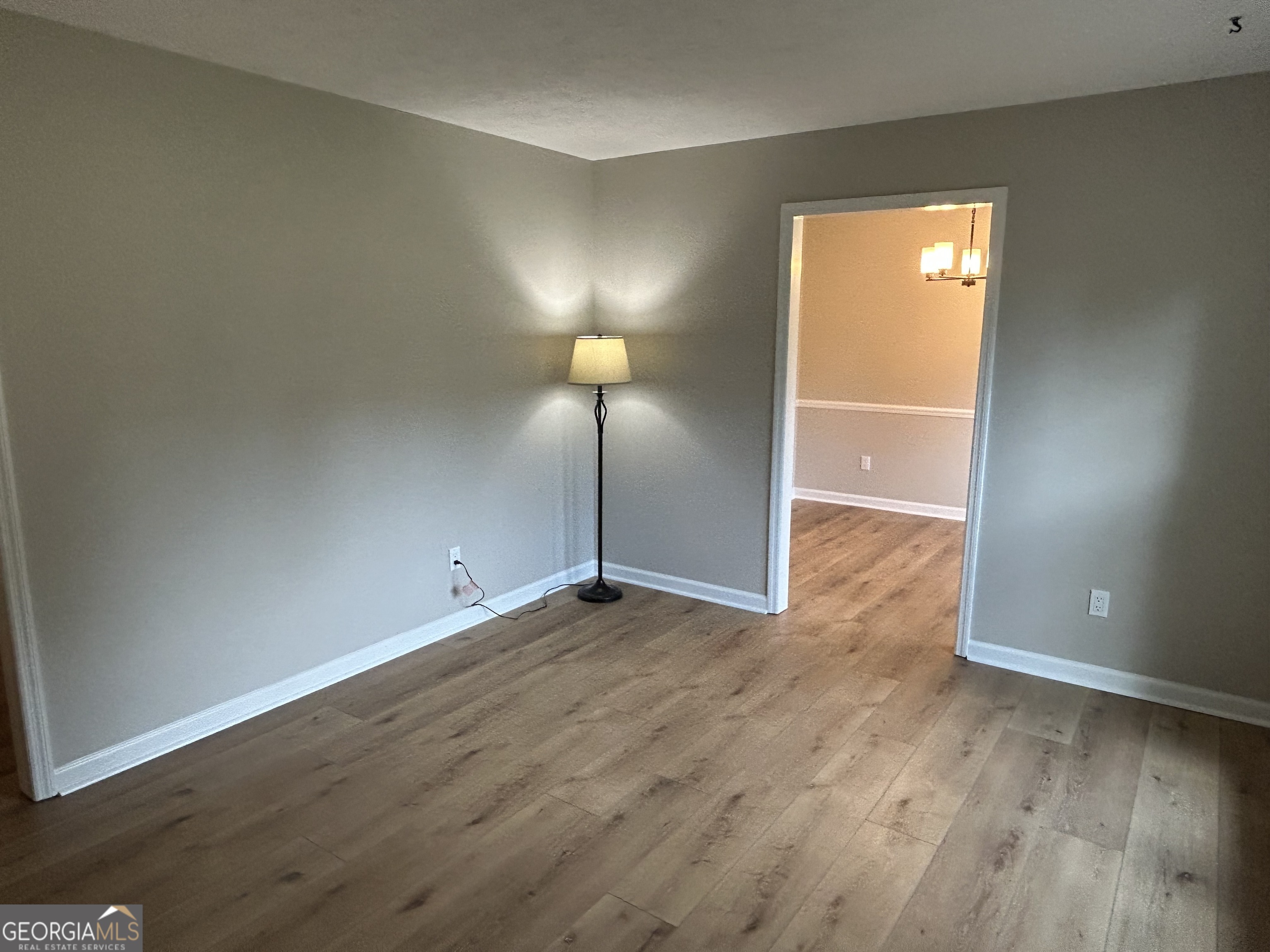 191 Moccasin Trail LaGrange, GA 30241 - Photo 8 of 32 an empty room with wooden floor and windows