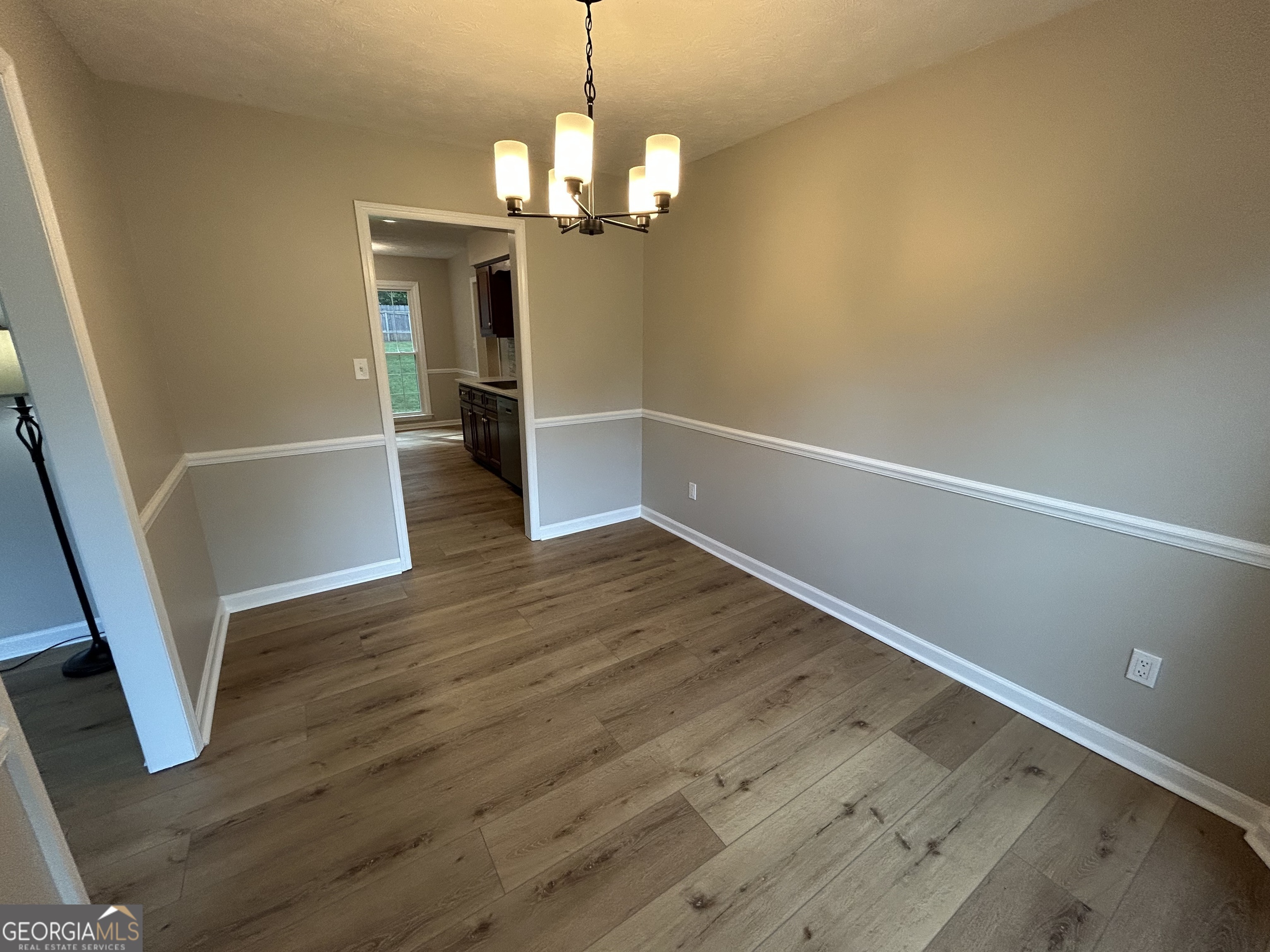 191 Moccasin Trail LaGrange, GA 30241 - Photo 10 of 32 wooden floor in an empty room with a window