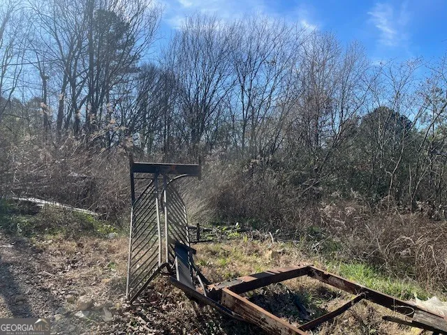 a view of a yard with an outdoor seating