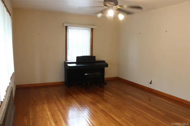 a view of a livingroom with wooden floor