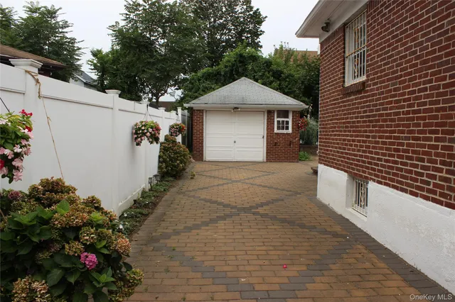 a front view of a house with a yard and a garage