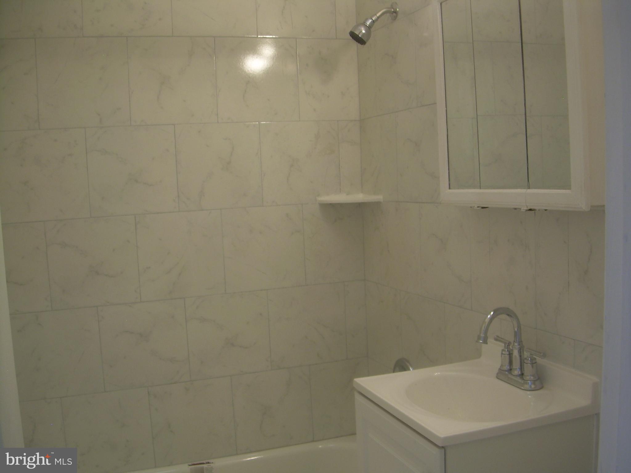 4214 Marple Street Philadelphia, PA 19136 - Photo 20 of 39 a bathroom with a sink and vanity