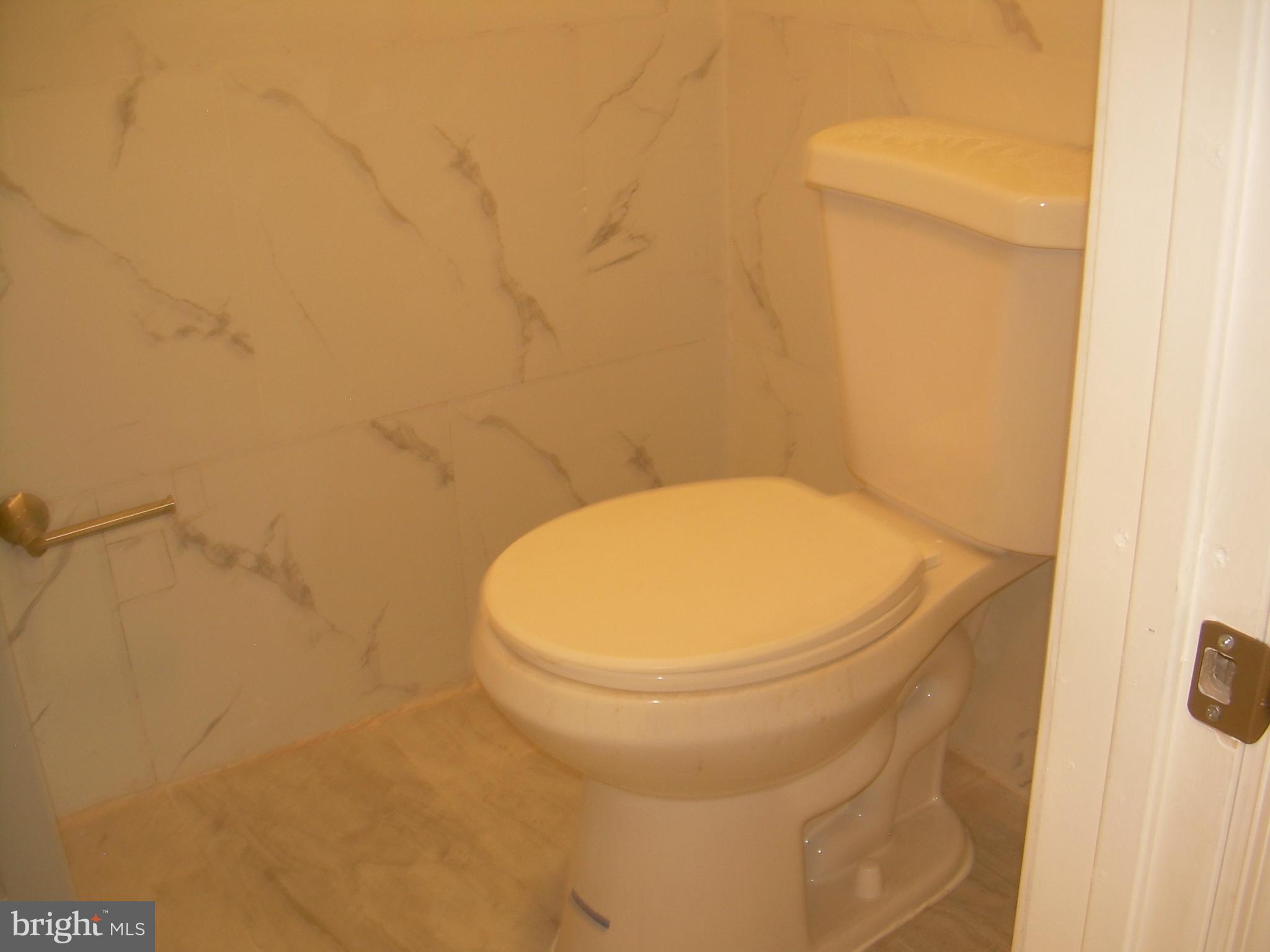 4214 Marple Street Philadelphia, PA 19136 - Photo 35 of 39 a bathroom with a toilet and a sink
